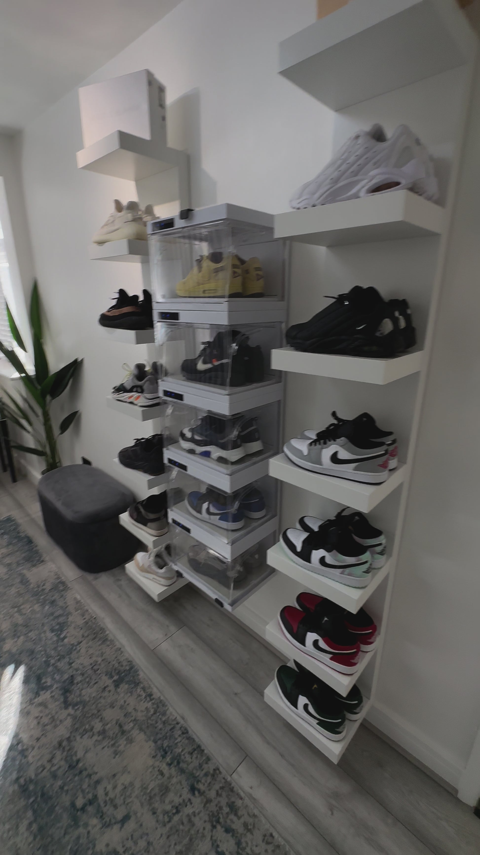 Sneakerwall display with remote controlled sneaker cases